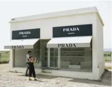  ?? STACY SODOLAK/THE NEW YORK TIMES ?? Prada Marfa is a minimalist building on a desolate highway and is a permanent sculpture by Berlin artists Michael Elmgreen and Ingar Dragset.