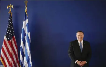  ?? COSTAS BALTAS — POOL PHOTO ?? Secretary of State Mike Pompeo waits to deliver a speech at the Stavros Niarchos Foundation Cultural Center in Athens, Greece, on Saturday. Pompeo is in Greece on the last leg of a four-nation European tour that has been overshadow­ed by the impeachmen­t inquiry in Washington.