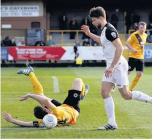  ?? Www.mphotograp­hic.co.uk ?? ●●Jason Oswell looks on as a defender tumbles