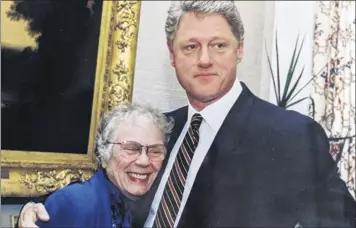  ?? White House Photo / Courtesy of the Brown family ?? Television makeup artist Lillian Brown with former President Bill Clinton in 1996.