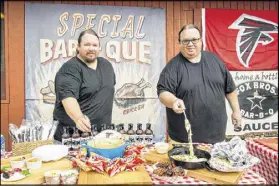  ??  ?? Fox Bros., owned by brothers Johnathan (left) and Justin Fox, is the “Official Bar-B-Q of the Atlanta Falcons.”