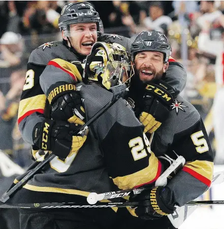  ?? — THE ASSOCIATED PRESS FILES ?? From left, Golden Knights’ Brayden McNabb, Marc-Andre Fleury and Deryk Engelland celebrate an overtime win in Game 2 of first-round playoff action on April 13 in Las Vegas.