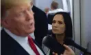  ??  ?? Stephanie Grisham listens as Donald Trump speaks to reporters aboard Air Force One on 7 August 2019. Photograph: Saul Loeb/AFP via Getty Images