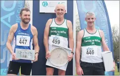 ?? ?? Carraig na bhFear AC’s Willie Walsh and Tony Dunne after securing 1st and 3rd places in the 3,000m at the Kilmacow Open, on the podium with the 2nd placed Waterford AC athlete.