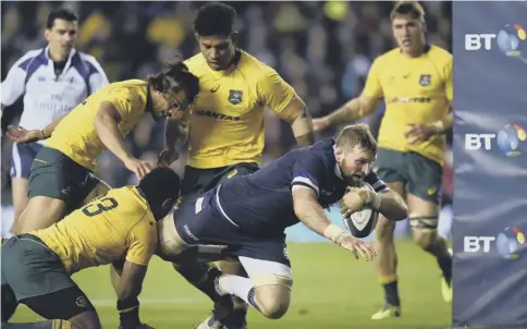  ?? PICTURE: ANDY BUCHANAN/GETTY ?? 0 John Barclay dives over the line to score a try for Scotland during Saturday’s defeat of Australia.