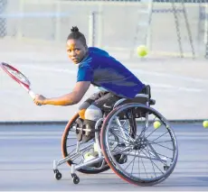  ?? - AFP photo ?? South Africa’s No1 wheelchair tennis player and the first African wheelchair tennis player to compete in all four Majors in a calender year, Kgothatso Montjane, plays a backhand shot during a training session at the High Performanc­e Centre in Pretoria.
