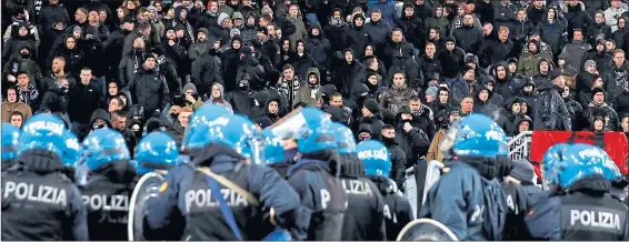  ??  ?? Police in riot gear stand guard during Lazio’s defeat to Eintracht Frankfurt last season at Stadio Olimpico, which Celtic visit on Thursday night