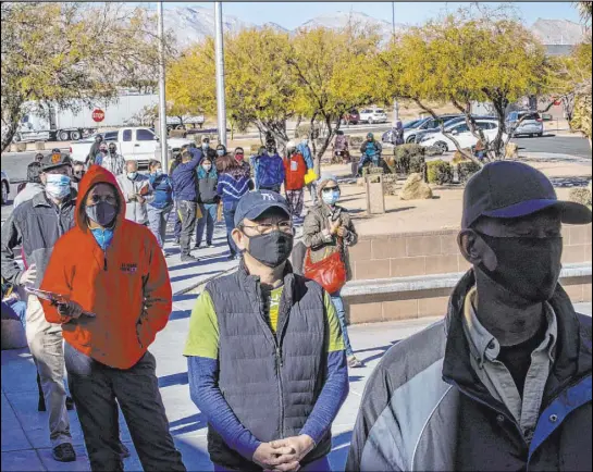  ?? L.E. Baskow Las Vegas Review-Journal @Left_Eye_Images ?? Long lines form Saturday outside the Nevada Department of Motor Vehicles office on West Flamingo Road.