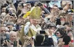  ?? Thomas Coex AFP/Getty Images ?? AMONG THE PEOPLE Benedict celebrates his first Mass as pope in St. Peter’s Square at the Vatican in 2005.