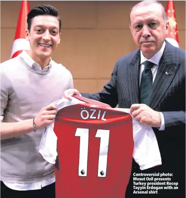  ??  ?? Controvers­ial photo: Mesut Ozil presents Turkey president Recep Tayyin Erdogan with an Arsenal shirt