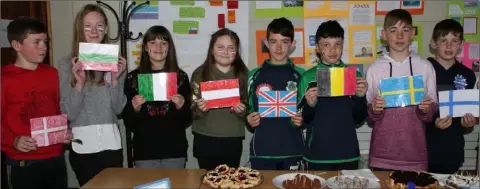  ??  ?? Some of the pupils with the flags of various EU countries.