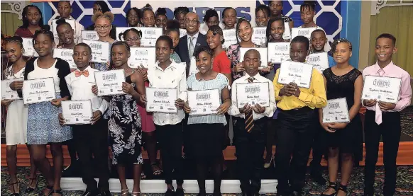  ??  ?? GSAT scholarshi­p recipients at the Courts Customer Scholarshi­p Awards Ceremony held at The Knutsford Court Hotel in New Kingston yesterday.