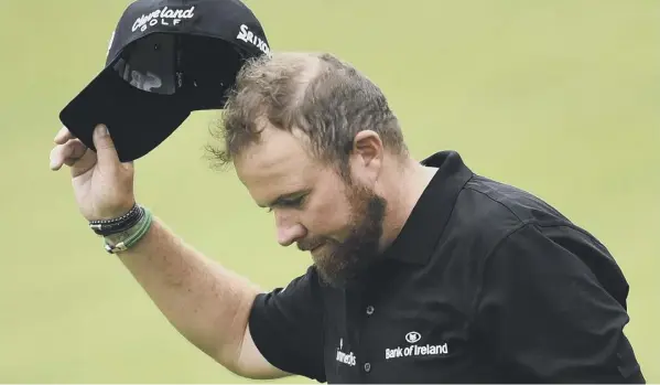  ??  ?? 0 Ireland’s Shane Lowry is joint leader of the Open at halfway after carding a second consecutiv­e 67 to join American JB Holmes on eight under par. REPORTS, PULL-OUT