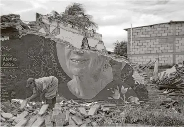  ?? Rebecca Blackwell / Associated Press ?? A man recovers bricks from a building destroyed in the earthquake in Union Hidalgo, Oaxaca state, Mexico. Mexico’s government is distributi­ng food to jittery survivors who have continued to sleep outside.