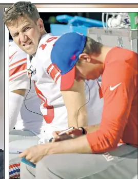  ?? N.Y. Post: Charles Wenzelberg ?? UNFAMILIAR TERRITORY: Eli Manning sits on the bench during the Giants’ 24-17 loss to the Raiders.