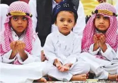  ??  ?? AFP Children take part in Eid prayers at a mosque in Bengaluru, the capital of Karnataka state.