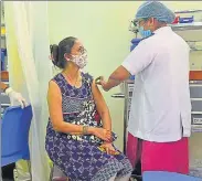  ??  ?? A health worker is vaccinated on Friday.