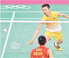  ??  ?? Chong Wei plays against Lin Dan during the men’s singles gold medal match at the London 2012 Olympic Games in London, in this August 5, 2012 file photo.