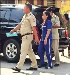  ?? KIM SAROM ?? Sam Sokha is escorted into the Supreme Court on Wednesday.