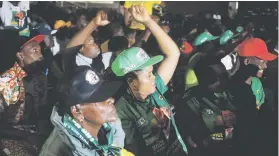  ??  ?? CELEBRATIO­N. Zanu-PF supporters cheer as they hear the results of yesterday’s Constituti­onal Court hearing in Harare, Zimbabwe.