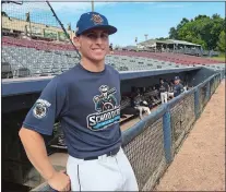  ?? GAVIN KEEFE/THE DAY ?? Jared Burrows of the Mystic Schooners, the former Waterford High School standout, poses in the dugout before Tuesday night’s game at Dodd Stadium in Norwich.