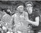  ?? CLARE GRANT/COLUMBUS DISPATCH ?? Ohio State guard Roddy Gayle Jr. looks to pass against Rutgers on Jan. 3.