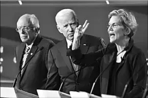  ??  ?? Van links naar rechts: Senator Bernie Sanders, oud-vicepresid­ent Joe Biden en senator Elizabet Warren tijdens een eerder debat tussen de beoogde presidents­kandidaten van de Democratis­che Partij in Ohio. (Foto: HLN)