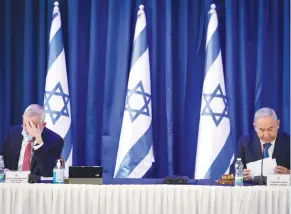  ?? (Marc Israel Sellem/The Jerusalem Post) ?? ALTERNATE PRIME MINISTER Benny Gantz and Prime Minister Benjamin Netanyahu at the weekly cabinet meeting in Jerusalem yesterday.