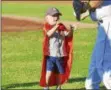  ?? PHOTO BY JOE BOYLE ?? Connor Daddario accepts his ball from the catcher after his ceremonial first pitch