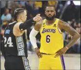  ?? Associated Press ?? Memphis Grizzlies forward Dillon Brooks (24) talks to Los Angeles Lakers forward LeBron James (6) during the second half of Game 2 in a first-round NBA playoff series, Wednesday, in Memphis, Tenn.