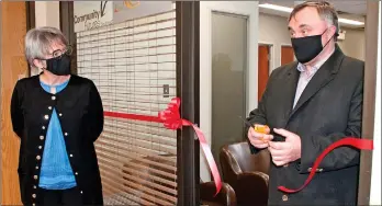  ?? SCOTT ANDERSON/SOUTHWEST BOOSTER ?? Swift Current Mayor Al Bridal cut the ceremonial ribbon with the assistance of Karla Wiens, CEO of the Swift Current & District Chamber of Commerce to officially open the Chamber’s new office location at #4-240 Central Ave. N.