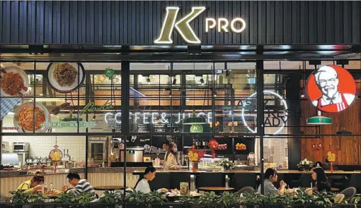  ?? PROVIDED TO CHINA DAILY ?? Consumers dine at KFC’s concept restaurant KPRO, which offers a selection of “green” foods, including quinoa salads, salmon sandwiches and fresh fruit juice, in Beijing.