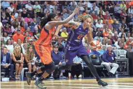  ?? M. ANTHONY NESMITH/AP ?? Mercury center Brittney Griner drives to the basket while defended by Sun forward Jonquel Jones during the second half of a WNBA second-round playoff game on Sunday.