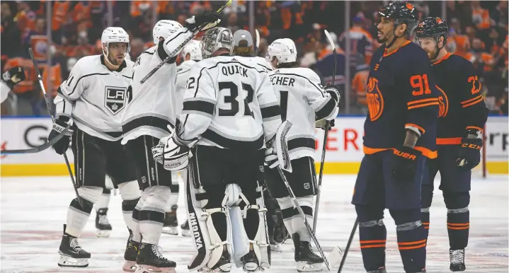  ?? — GETTY IMAGES FILES ?? The Los Angeles Kings celebrate a 5-4 overtime victory over the Edmonton Oilers in Game 5 of their first-round playoff series Tuesday in Edmonton.