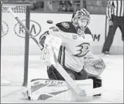  ?? Tom Mihalek Associated Press ?? DUCKS GOALIE Kevin Boyle watches the puck f ly past the net in Saturday’s game in Philadelph­ia.