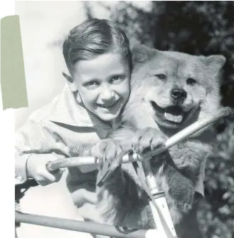  ??  ?? WITH DADS AND brothers serving in the war, many children rely on pets as play pals in the 1940s.