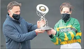  ??  ?? Rachael Blackmore and Trainer Henry De Bromhead celebrate with the trophy after yesterday’s success