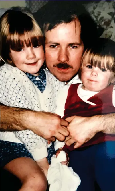  ??  ?? ‘MY BIG, STRONG DAD’: Young Katie, left, and her younger sister Laura with their father in 1985