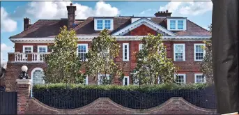  ?? ?? FOR SALE: The luxurious Wimbledon house. Right: Simon Cowell and Lauren Silverman