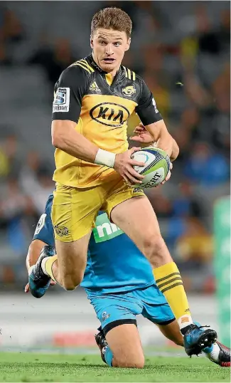  ?? GETTY IMAGES ?? Beauden Barrett makes another break against the Blues at Eden Park last night.