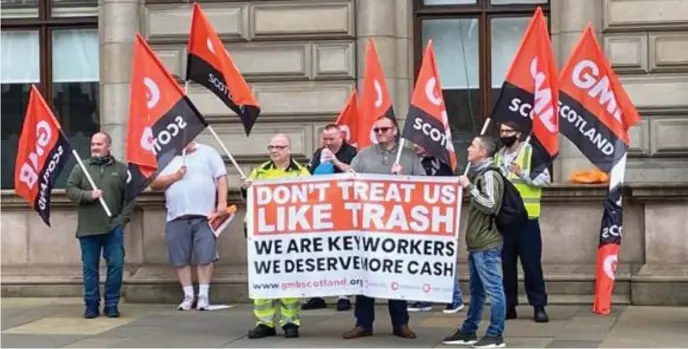  ??  ?? GMB members demonstrat­e outside Glasgow City Chambers, and below, union convener Chris Mitchell