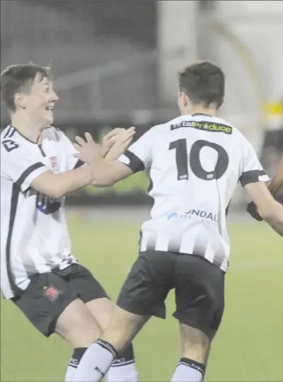  ??  ?? David Doyle celebrates scoring Dundalk’s third goal with teammates during the League U-15 Shield Final at Oriel Park.