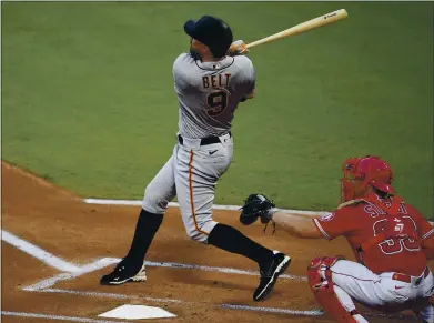  ?? KELVIN KUO — THE ASSOCIATED PRESS ?? The Giants’ Brandon Belt follows through on a two-run home run against the Los Angeles Angels on Monday.