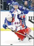  ??  ?? Tampa Bay Lightning defenseman Ryan McDonagh (27) takes down New York Rangers center Mika Zibanejad (93) during the third period of an NHL hockey game onDec 10 in Tampa, Florida. (AP)