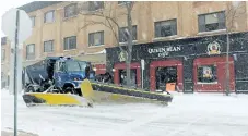  ?? ALISON LANGLEY/NIAGARA FALLS REVIEW ?? A snow plow clears snow from Ontario Avenue in downtown Niagara Falls Tuesday.