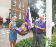  ?? John Torsiello / For Hearst Connecticu­t Media ?? Lynn Zanderigo Florio and Torrington Public Works Director, Raymond Drew, prepare to raise the Purple Heart flag.