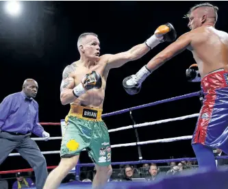  ?? CLIFFORD SKARSTEDT/EXAMINER FILES ?? Peterborou­gh's Jay Corcoran (green trunks) fought to a four-round draw with opponent Jason Kelly on Sept. 30 before 3,010 fans at the Memorial Centre in a rematch of their May 10 bout won by Kelly. They will renew their rivalry for a third and final...