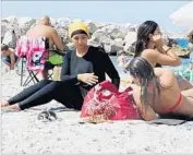  ?? Associated Press ?? ON A BEACH in Marseille, France, Nesrine Kenza says she is happy to be free to wear a “burkini.”