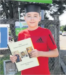  ??  ?? In and out Minishant pupil Aiden Murray’s time at primary was over in a flash