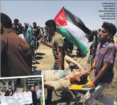  ?? PHOTO: GETTY IMAGES ?? A Palestinia­n wounded in the violent demonstrat­ions at the Gaza border fence in May this year